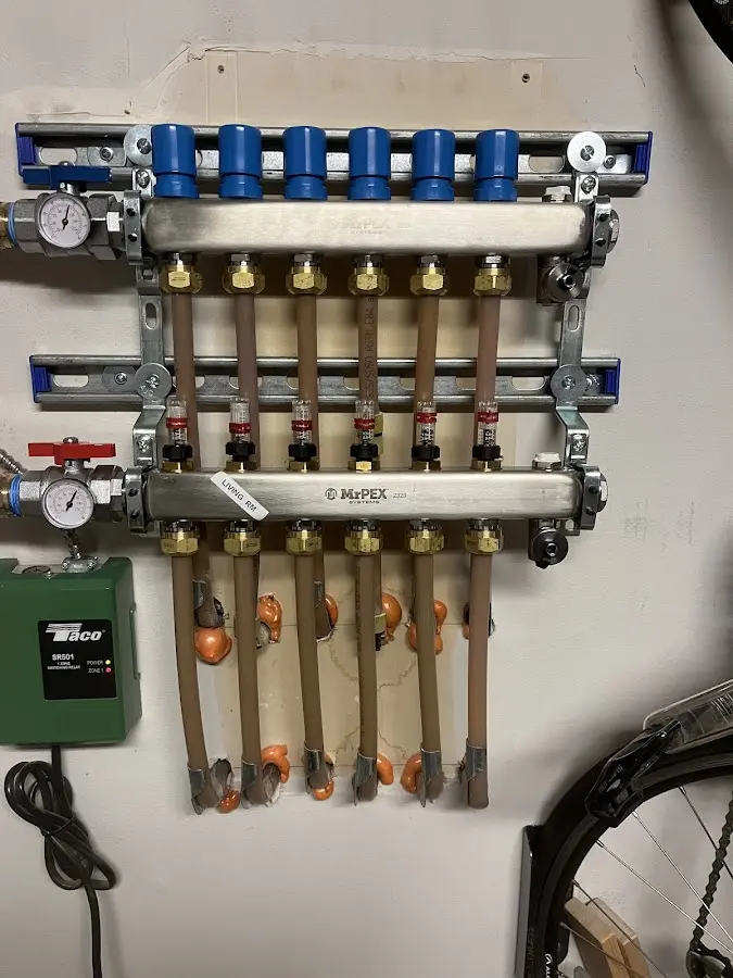 Plumber performing Water Heater Repair at a residential property in Ogden